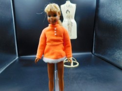 blonde skipper orange top